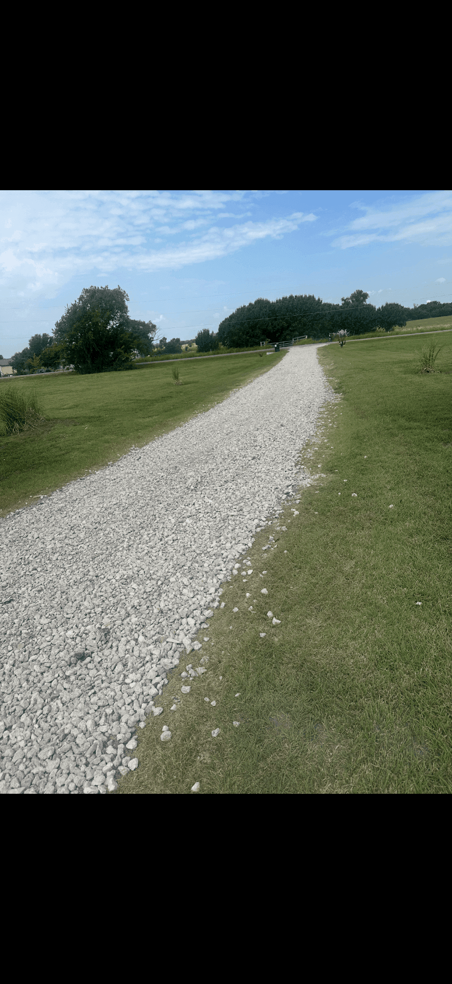 Finished gravel drive and outdoor access area for a larger property project