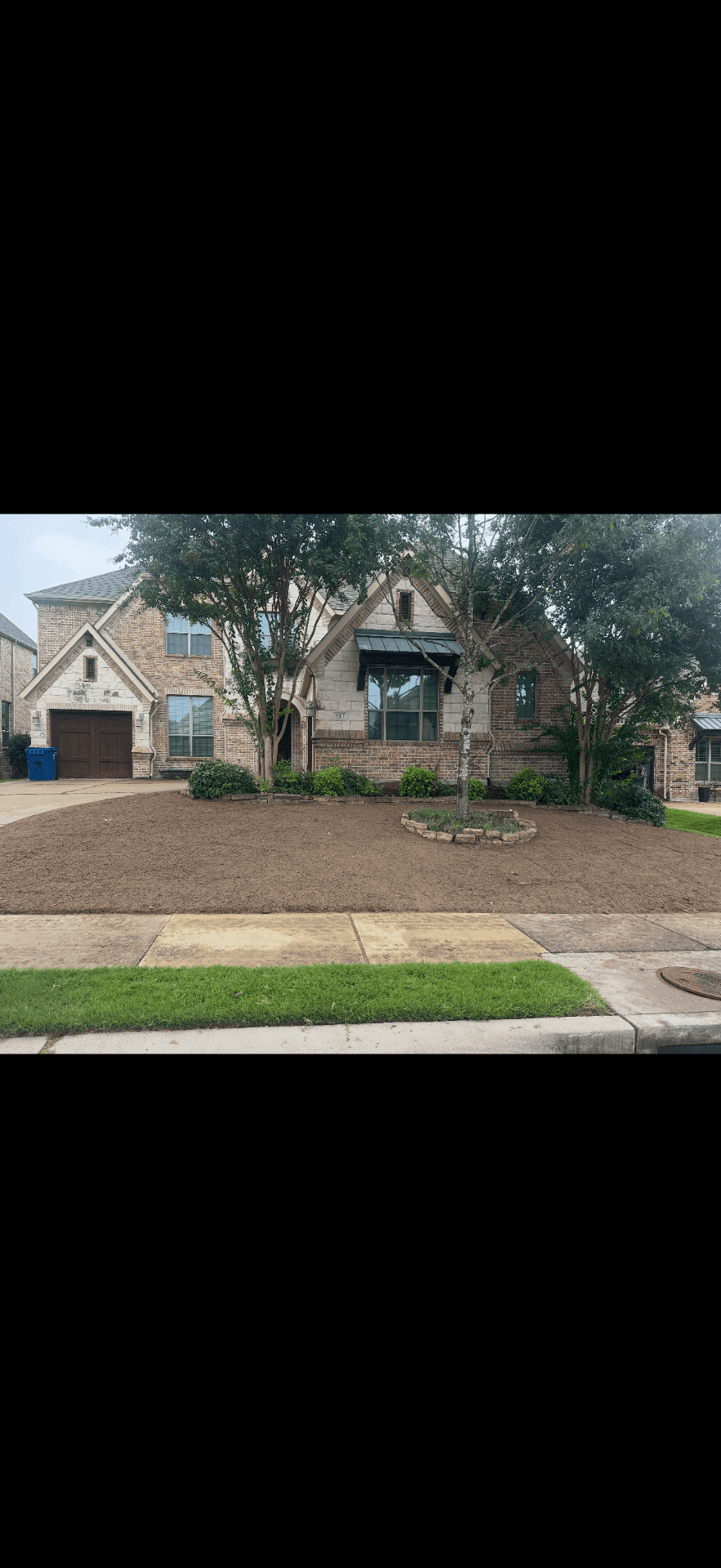 Fresh mulch beds and landscape refresh around a DFW residential property