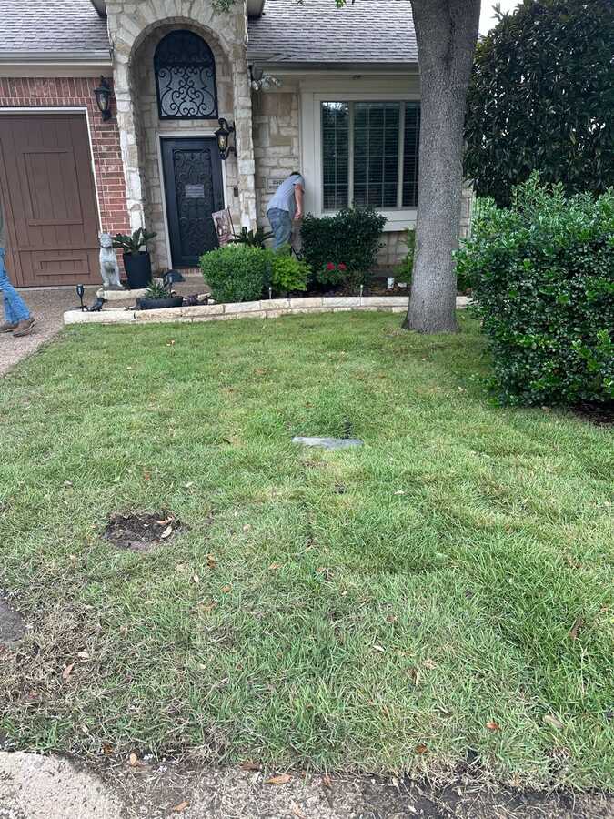 Nextdoor project photo showing outdoor work near a front entry and yard